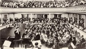 interior of packed concert hall during a concert