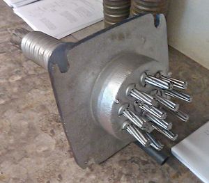 a detached anchor displaying tendon lock-offs