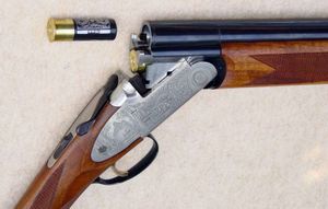 상하 2연장 총의 로킹 래그. 총신 하부 돌기와 맞물리는 구조이다.