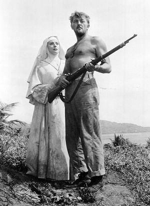 1957년 영화 헤븐 노즈, 미스터 앨리슨(Heaven Knows, Mr. Allison)에서 데보라 커(Deborah Kerr)와 함께한 미첨