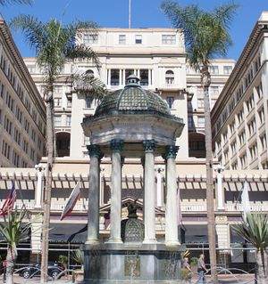 Oval, black and white shoulder-height portrait of a man in his forties or fifties, slightly balding wearing a suit