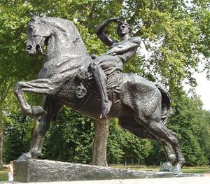 outdoor statue of a horse with a naked male rider