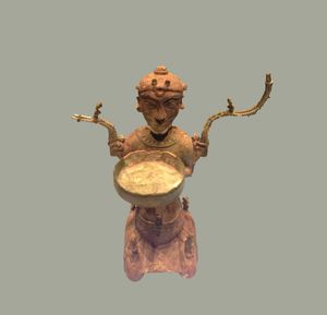 동선 문화의 청동등 조각상, "무릎 꿇은 사람"으로 알려짐