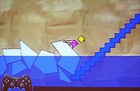 물에서 블록을 끌어내는 미스터 옐로헤드를 묘사한 초기 프로토타입 Craftworld의 스크린샷