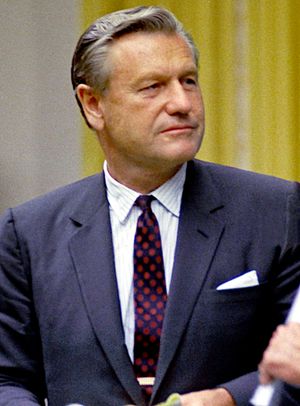 Shot of a middle-aged man, dressed in a business suit.