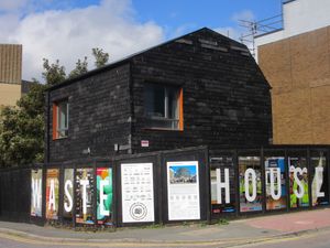 Waste House, on Brighton University campus, is a sustainable building constructed using waste materials to showcase sustainable construction practices.