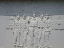 부조로 묘사된 사릿 타나랏의 삶, 1957년 콘깬에서 그의 쿠데타를 묘사하고 있다