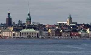 A landscape image of a city setting including a river.