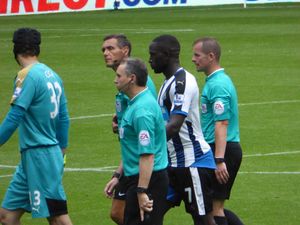 무사 시소코가 2015년 뉴캐슬 유나이티드에서 아스널을 상대로 플레이하는 모습