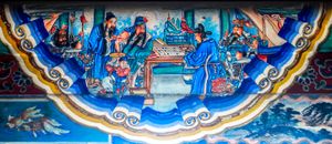 마량이 관우와 바둑을 두는 동안 화타가 독이 든 팔을 뼈를 깎아 치료하는 모습(刮骨療毒), 베이징 이화원의 장랑에 있는 초상화