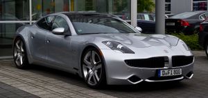 A front three-quarters view of a grey Fisker Karma sedan