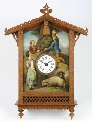 'Bahnhäusle' 스타일의 뻐꾸기시계 견본 (완제품이 아닌, 무브먼트가 없는 케이스), 1861년 'Vogelfänger'( "새 사냥꾼")이 뻐꾸기를 허탕치고 기다리는 모습을 묘사한 그림이 그려진 주석판 (독일 시계 박물관, Inv. 18–0224).