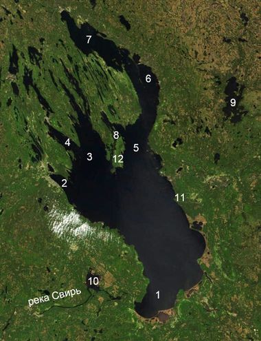 2002년 5월, 우주에서 본 오네가 호. 1. 스비르스크 만, 2. 페트로자보도스크 만과 페트로자보도스크 시, 3. 대 오네가 만, 4. 콘도포시스카야 만, 5. 소 오네가 만, 6. 자오네지스키 만, 7. 포베네츠키 만, 8. 키지 섬, 9. 보드로제 호와 보드로제 국립 공원, 10. 이빈스키 유출구와 스비르 강, 11. 베소프 노스 곶("악마의 코"), 12. 빅 클리메네츠키 섬