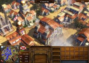 여러 개의 방어벽 뒤에 안전하게 자리 잡은 플레이어가 설계한 제국 시대 마을 (미니어처 지도, 왼쪽 하단 참조). 공장 (중앙) 포함.