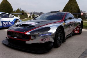 DBRS9 in white with a large, black spoiler, covered with livery, on the track.