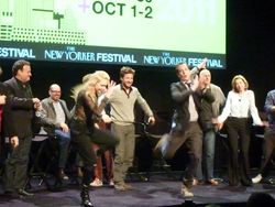 Actors from <i>Arrested Development</i> dancing on a stage