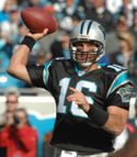 A picture of Vinny Testaverde while throwing a football.