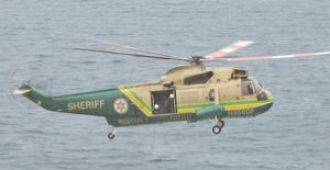 LASD's Rescue 5, a Sikorsky SH-3H Sea King helicopter, flies offshore near Point Vincente Park in Rancho Palos Verdes.