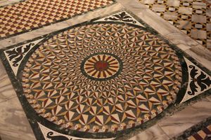 intricately patterned floor with coloured marbles