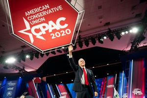 Pence smiling and waving