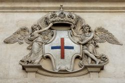 로마의 산 카를로 알레 콰트로 폰타네 (1638–1641) 정면에 있는 삼위일체 수도회의 석재 방패