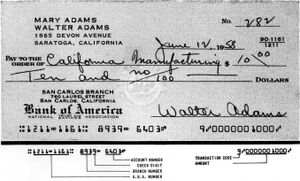 수표에 E-13 MICR 글꼴을 사용한 초기 시연. "transit" 글리프는 E-13B와 다릅니다.