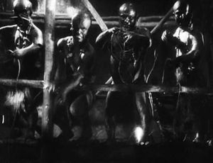 블랙페이스를 한 작은 사람들이 피그미족으로 연기했다.