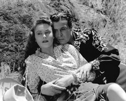 조로의 검은 채찍(1944)에서 조지 J. 루이스와 린다 스털링.