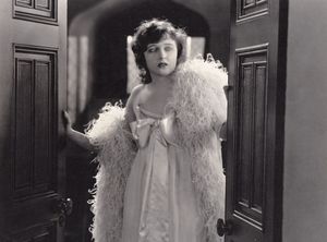 Woman walking through a door