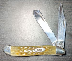 A W.R. Case "Peanut" model with clip and spey blades