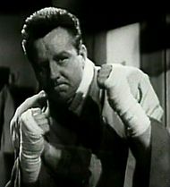 코미디 영화 The Admiral Was a Lady(1950)에서 복서 마이크 오할로란 역을 연기하는 브로디