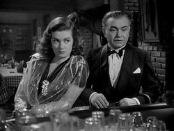 크리스 크로스를 연기하는 에드워드 G. 로빈슨과 키티 마치 역의 조앤 베넷