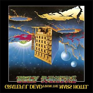 From the Mars Hotel 앨범 커버의 거울 이미지, "Ugly Rumors" 텍스트를 보여줌.