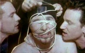 애덤 클레이턴이 디 에지를 묶고, 멀렌이 "I feel numb"라는 가사를 부르고, 보노가 "Too much it's not enough"를 부르는 뮤직 비디오