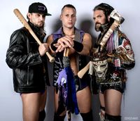 초대 챔피언 더 킹덤 (T. K. O'Ryan (왼쪽), 맷 테이븐 (가운데), 비니 마르세글리아 (오른쪽)), 이들은 또한 팀으로서 3회로 최다 통치 기록을 보유하고 있으며, 비니는 개인으로서 4회로 최다 통치 기록을 가지고 있다(그의 4번째 통치 당시, 그의 링네임은 빈센트로 변경되었다)