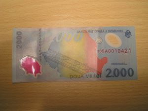 1999년 일식을 기념하여 발행된 플라스틱 지폐. 루마니아 지도에 개기대가 그려져 있다.