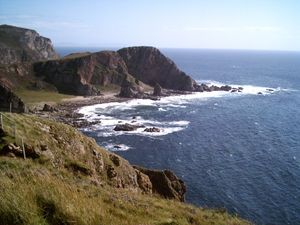 포트 난 갈란, 오아 반도(The Oa)와 멀리 희미하게 보이는 킨타이어 (스코틀랜드 본토)의 윤곽