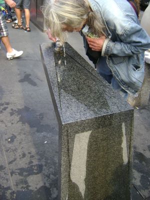 The square features two public drinking fountains.