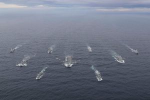 a group of warships at sea seen from high up