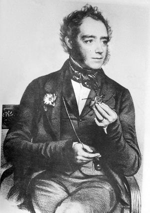 존 O. 웨스트우드가 골리앗 딱정벌레를 들고 있는 모습